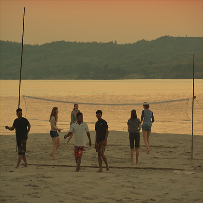 Playing volley ball on the sand banks