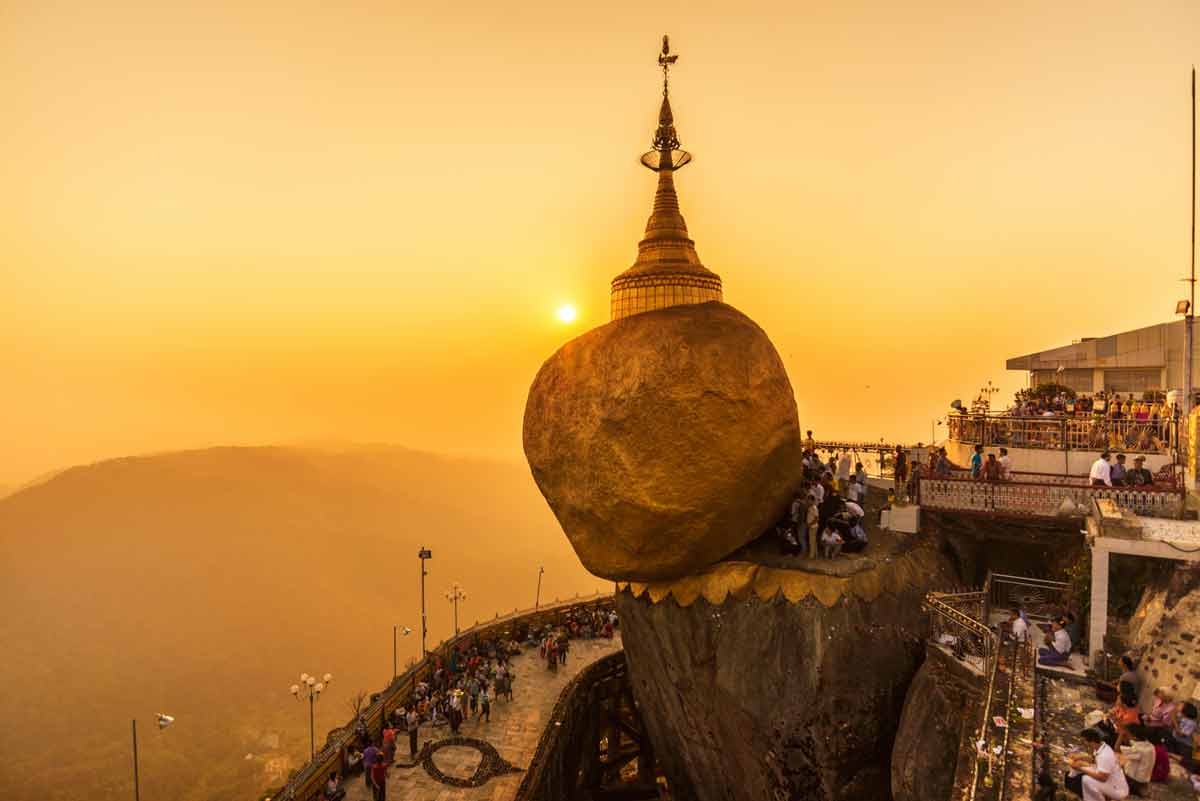 The magnificent Golden Rock on the edge of the hill with scenic views of Kyaiktiyo