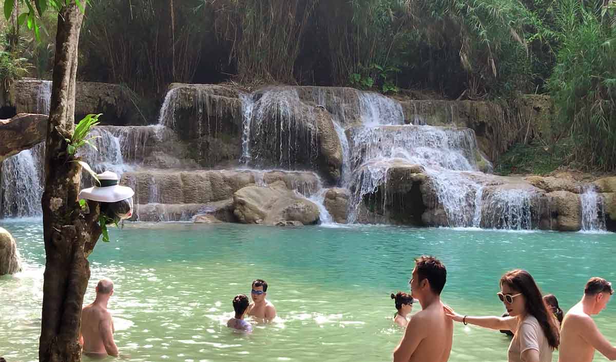 People swimming in the Kuang Si Waterfalls